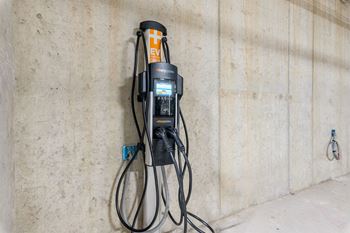 a drill press hangs on the wall of a building